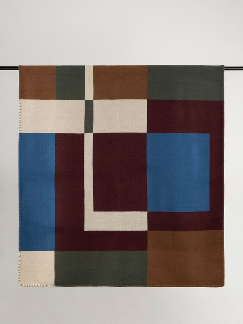 Multi-colour geometric design wool blanket.