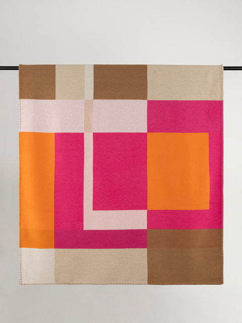 Multi tone pink, brown and orange geometric design wool blanket.