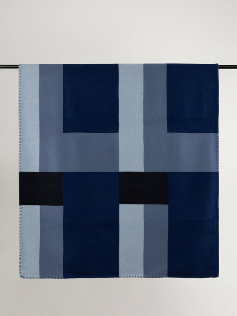 Multi-shade blue geometric design wool blanket.