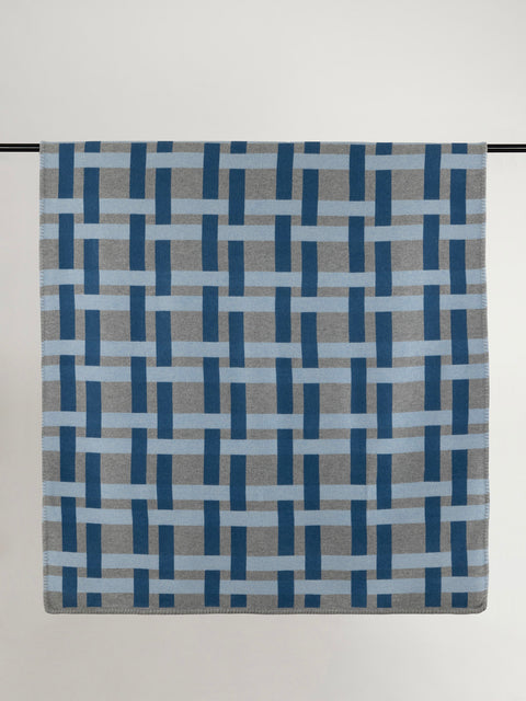 Multi-tone blue and grey geometric weave design wool blanket.