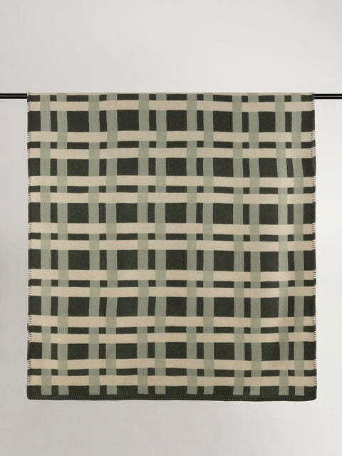 Multi-tone green geometric woven design wool blanket.